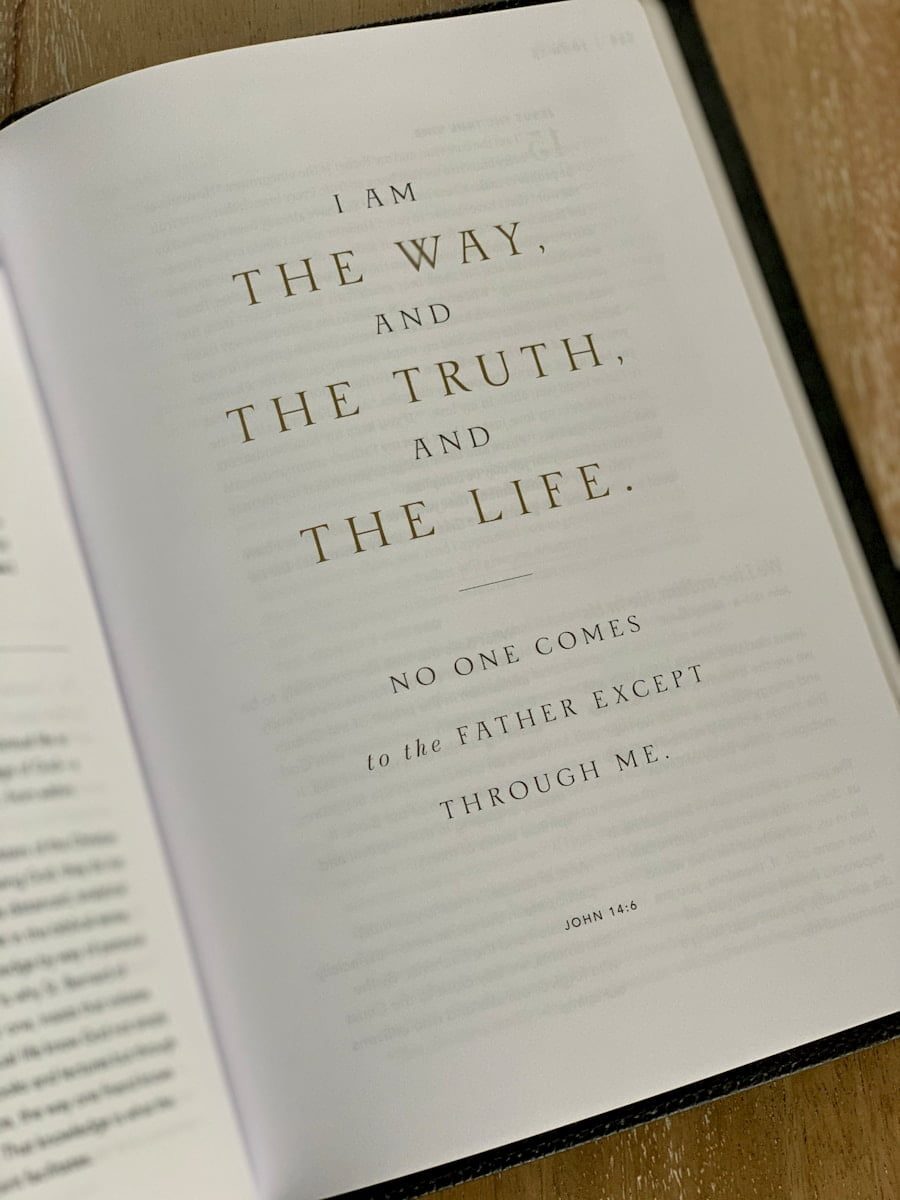 An open Bible showing John 14:6 — I am the way, and the truth, and the life
