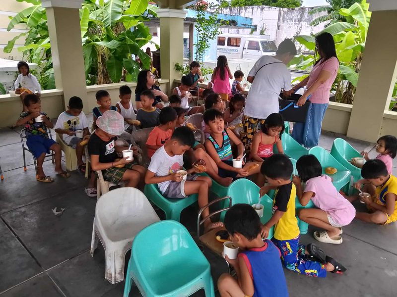 Children and workers at a partner-church gathering